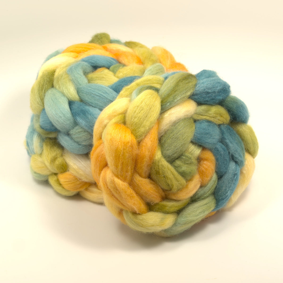 Hand painted 75/25 BFL tussah silk combed top in butter yellow, golden yellow and dusty teal