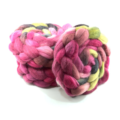 Hand painted BFL tussah silk combed top, hot pink, cranberry and butter yellow, two-bun stack