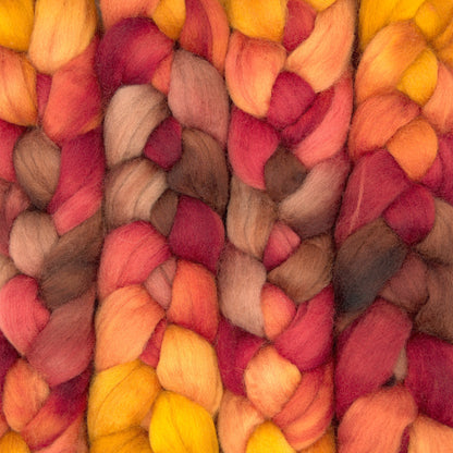 Hand painted Corriedale combed top in terracotta, tangerine and brick red