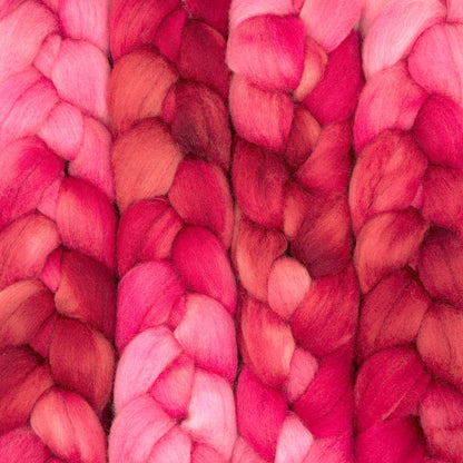 Hand painted Corriedale combed top in crimson, hot pink and raspberry